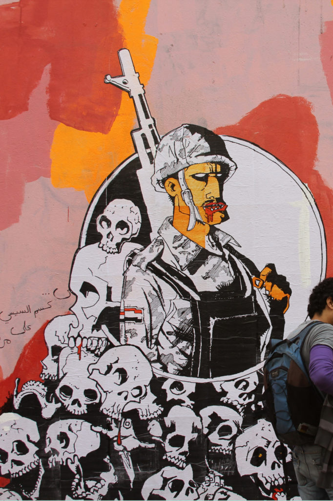 “The Army Above All Else,” a paste-up by the visual artist known as Ganzeer, on Mohammed Mahmoud Street, November 2013. Source: Ganzeer.com