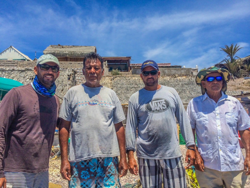 Los hombres del Pardito, the men of Isla Pardito: from left, the son of Pablo and lead guitarist for the band, Roberto, another band member, and Pablo.