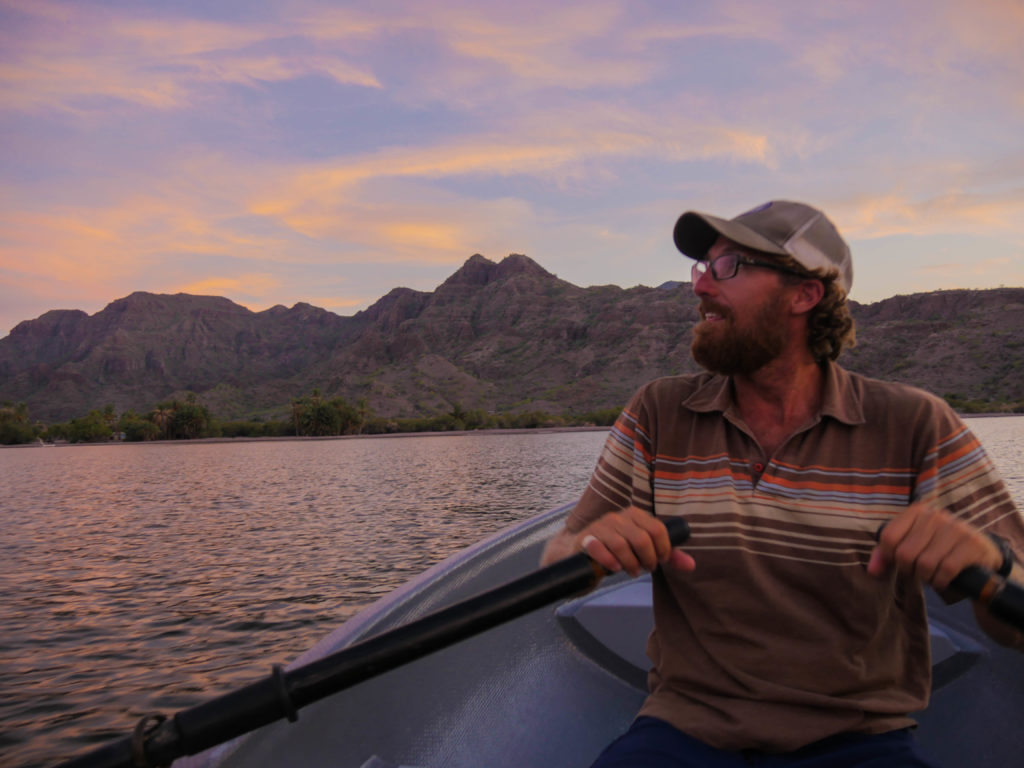 Josh rowing the dinghy in the evening.