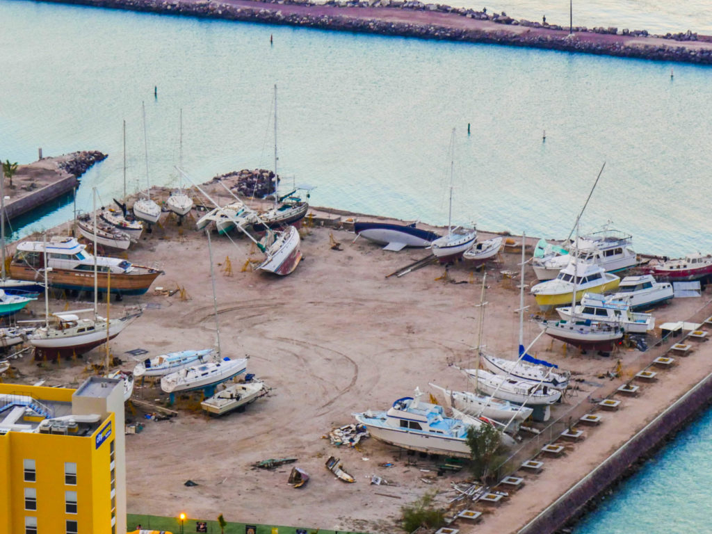 Boats remain toppled in a La Paz boatyard a year after Hurricane Odile knocked them down.