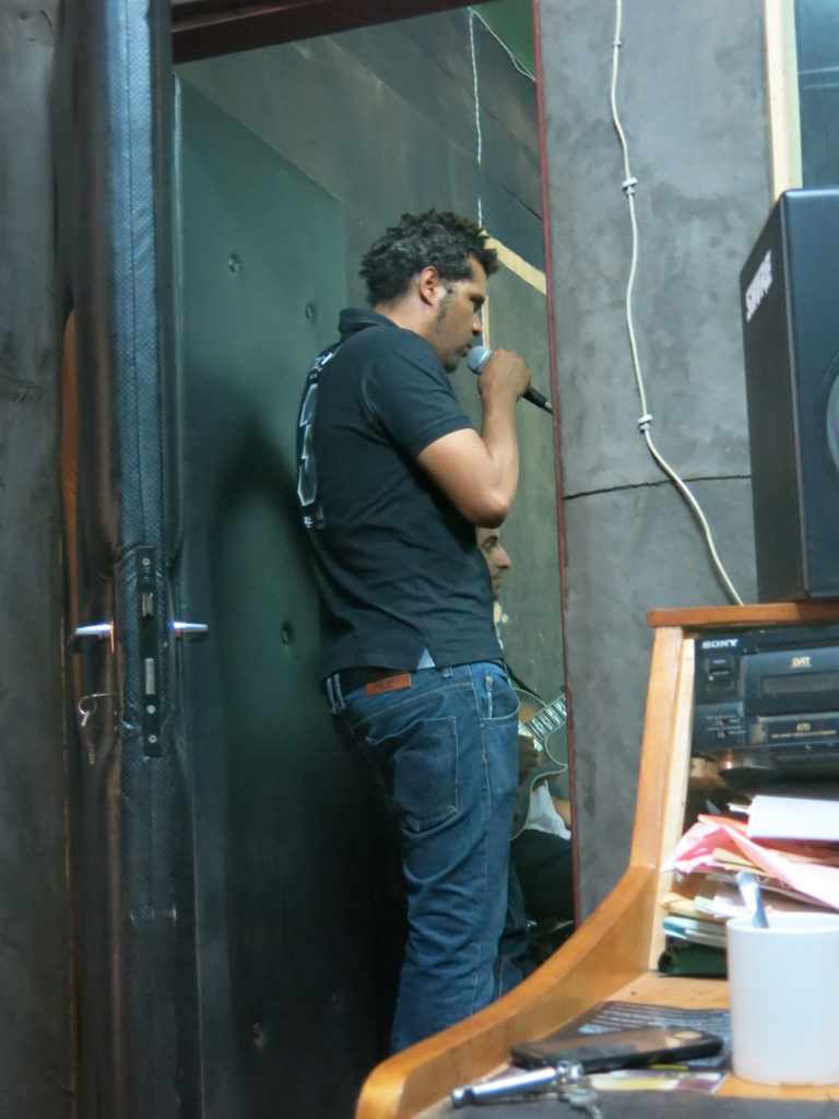 Smockey recording in his studio.