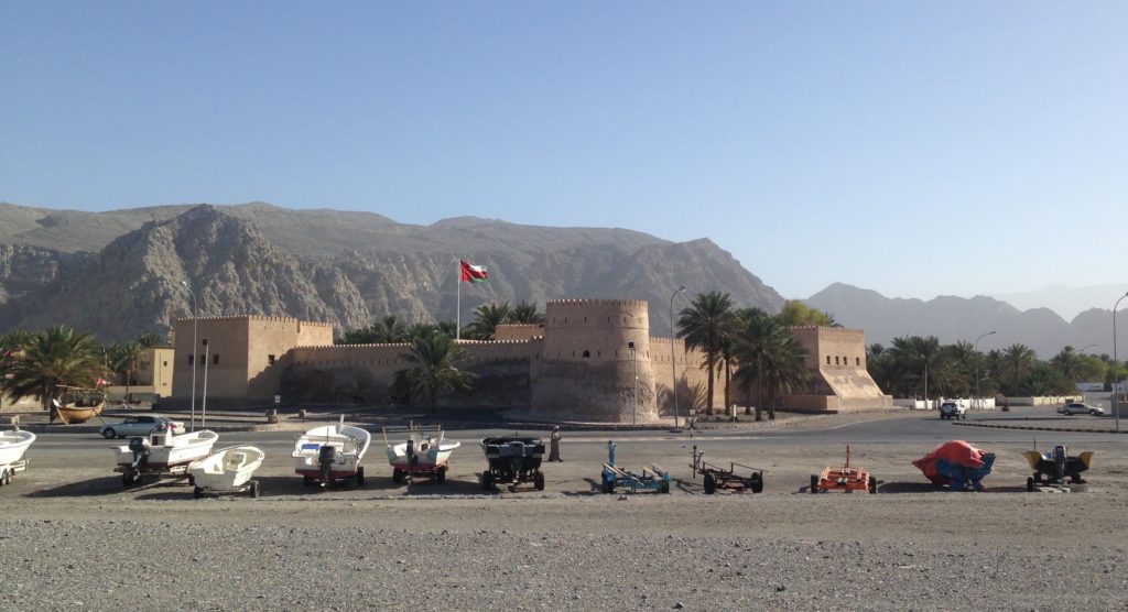 Boats lined up outside the Portuguese-era fort in Khasab