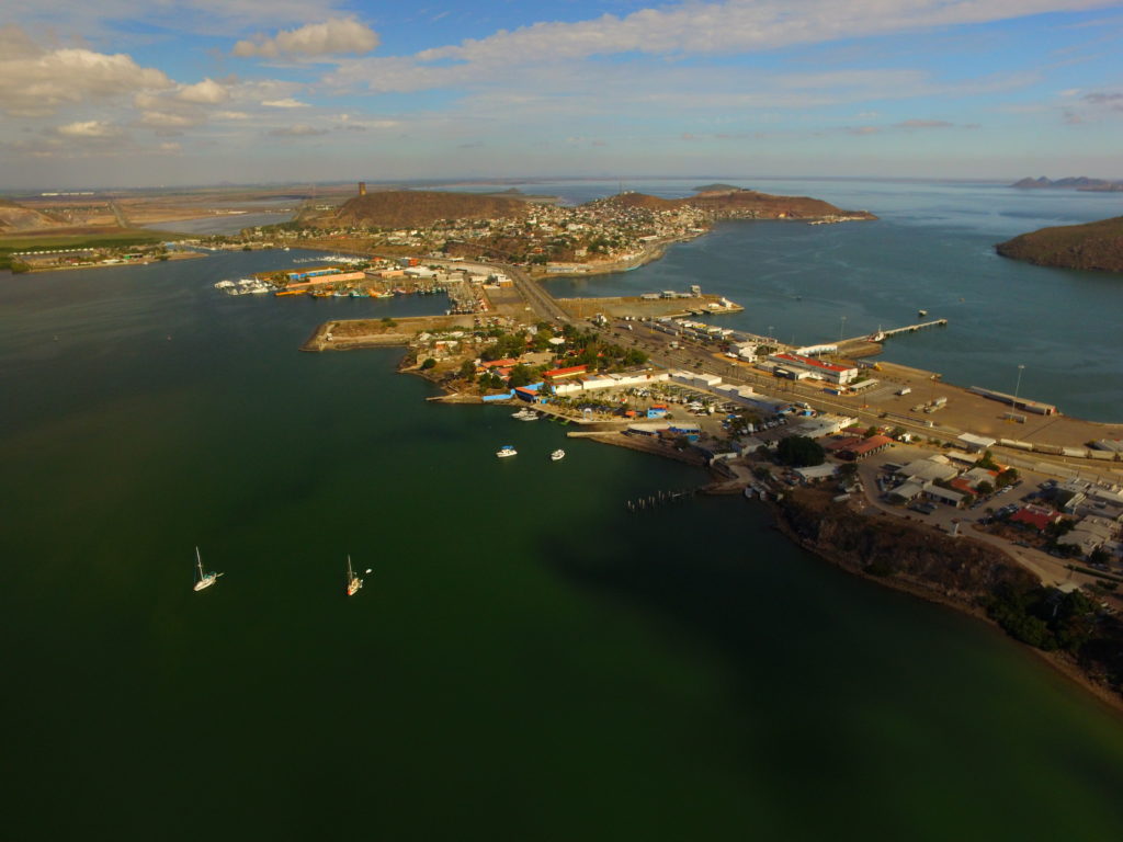 A view to the tiny península town of Topolobampo. The two sailboats are anchored (in very little water) in the foreground, and I’m chatting with Davíd out of the frame in a small bay to the left. In the distance to the right is the vast Bahía Ohuíra.