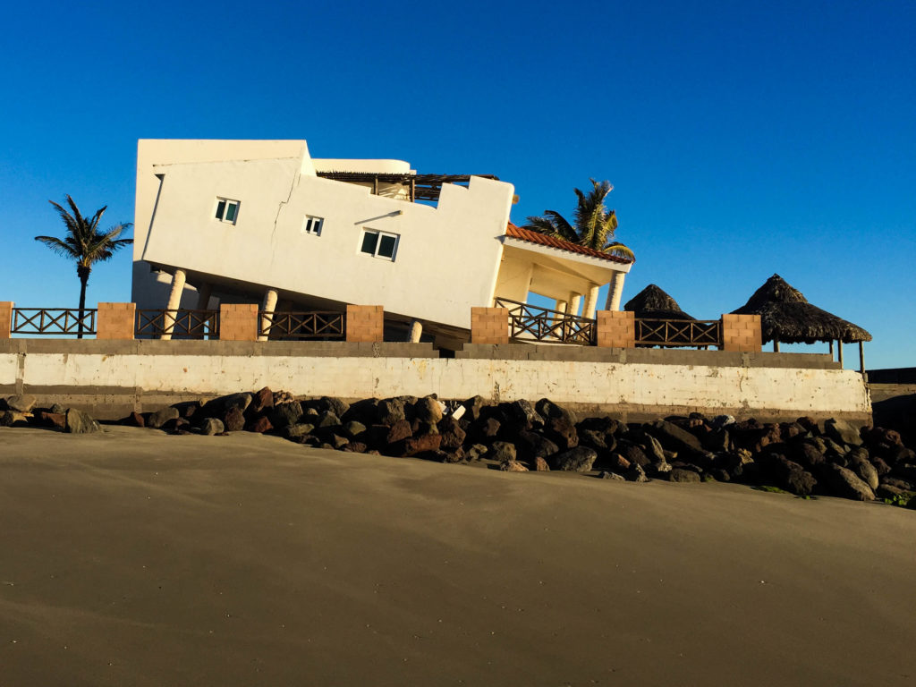Despite a rock wall, the beach in front of the house gave way to the Pacific, leaving the luxury home nosediving into the sea.