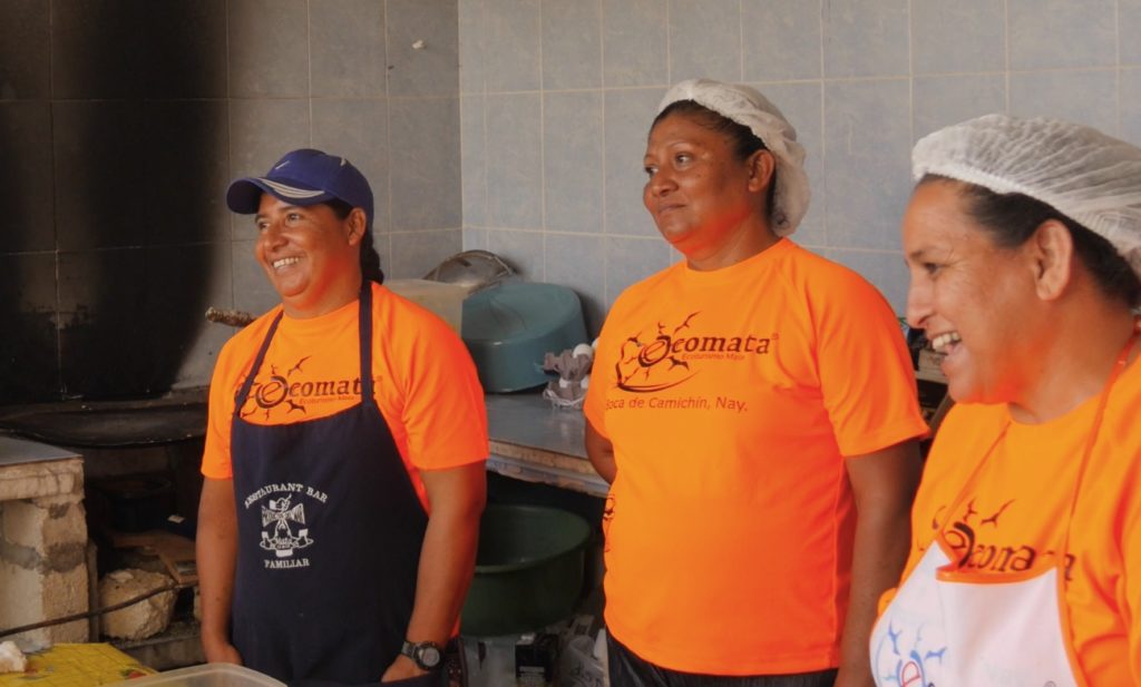 Talking in the kitchen with Aurora, Josefina, and Yolanda.