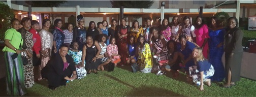 Conference participants pose for the camera at the WIN Conference Cocktail Dinner.