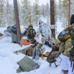 Rifles, skis and snow tanks